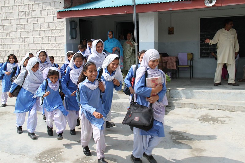 A photo of Pakistani school girls walking out of school