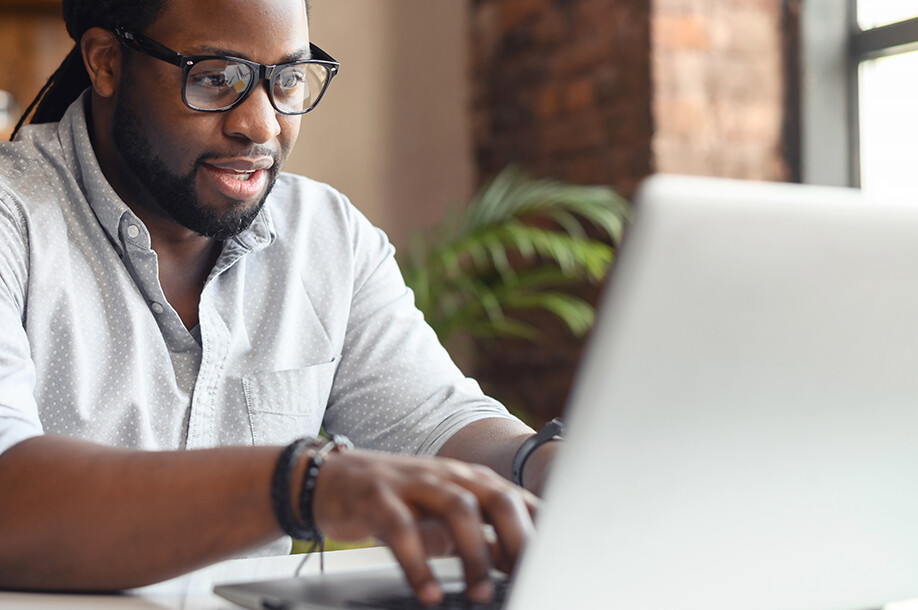 Man typing on a laptop