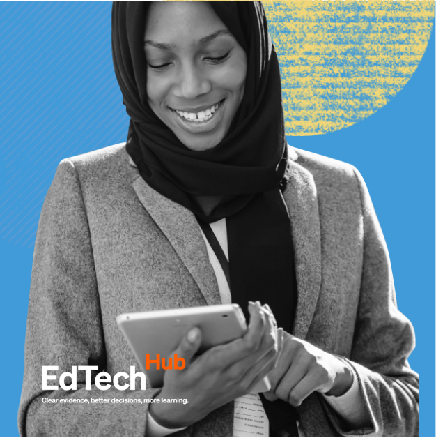 A lady holds an i-pad studying the screen, set on a blue background