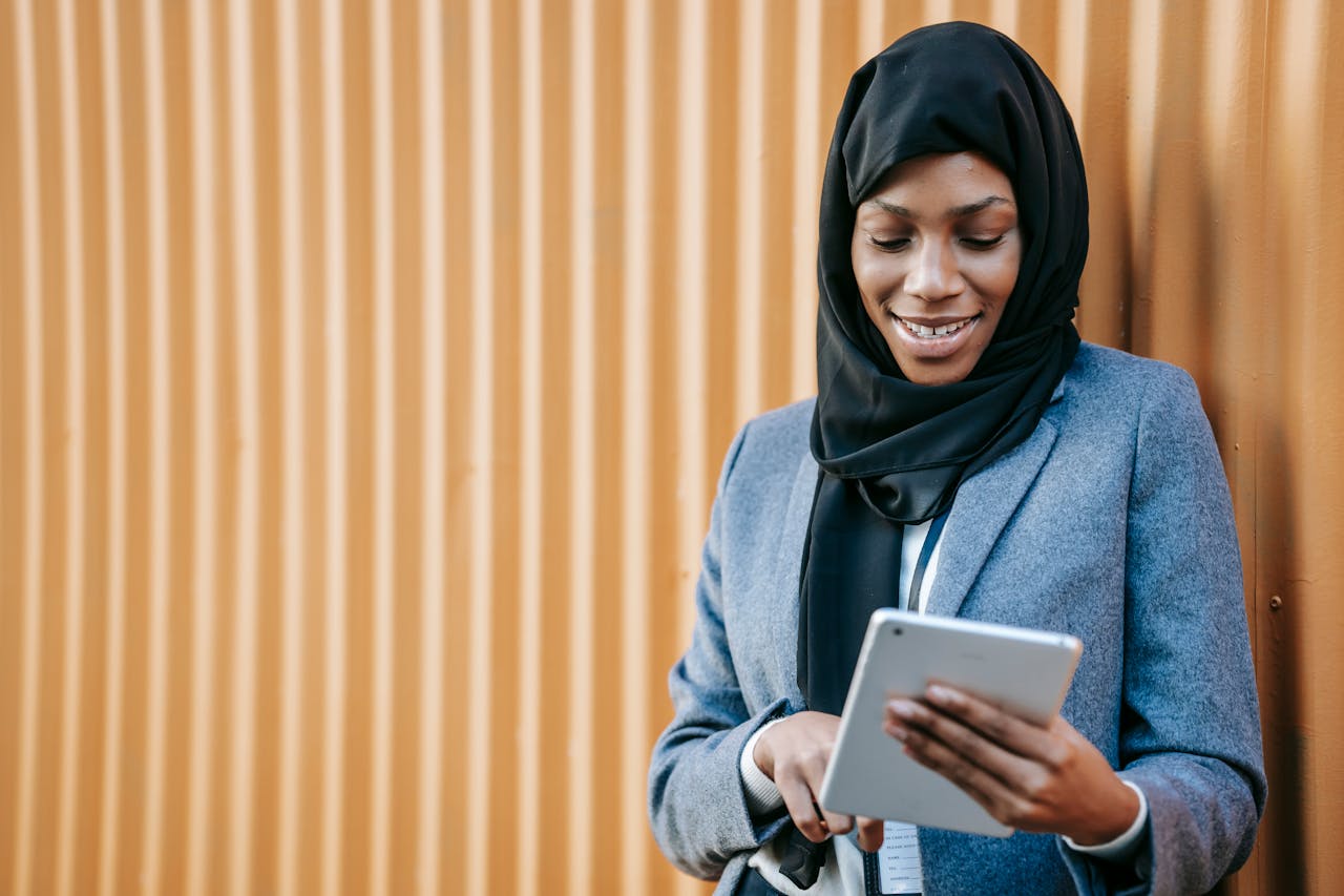 A woman engages with her email on a tablet (credit: ono-kosuki, pexels)